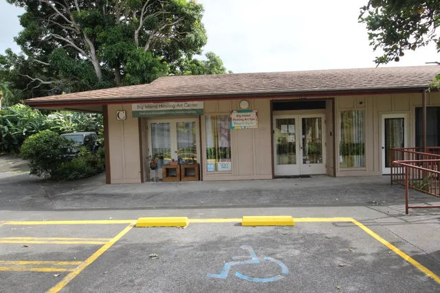 a view of a white house with swimming pool in front of it