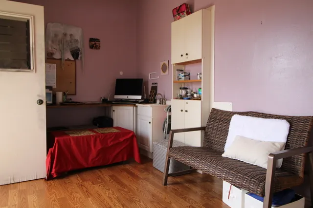 a bedroom with furniture and a flat screen tv