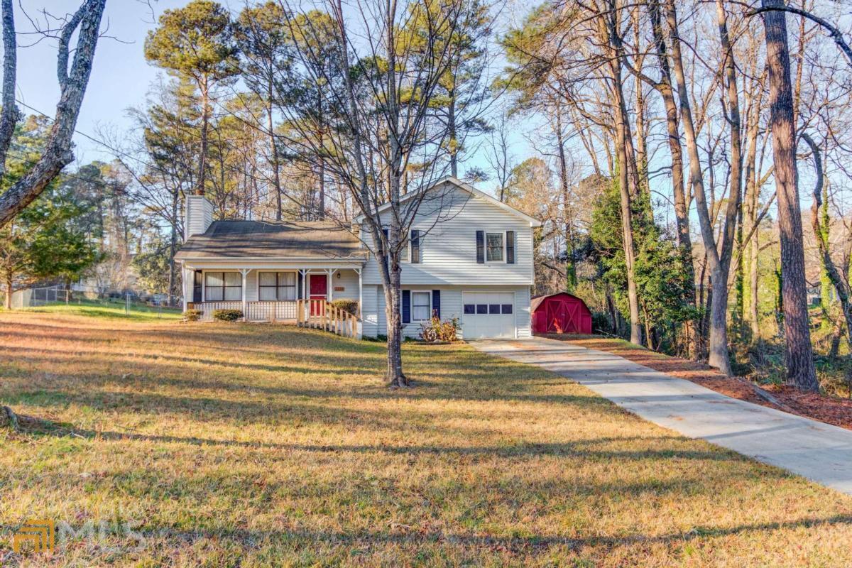 2223 Rio Grande Court Snellville, GA 30078 - Photo 1 of 1 a view of a trees in front of building