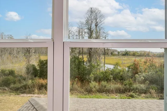 a view of an empty room and closet area