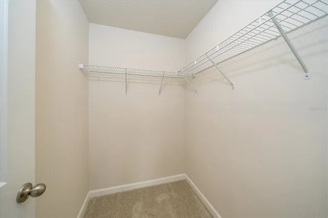 a large bathroom with a tub sink shower and mirror