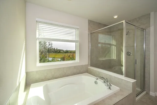 a bathroom with a sink double vanity and a mirror