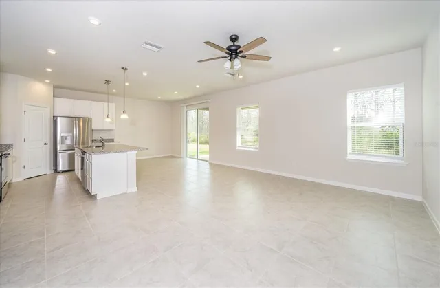 a view of a kitchen with a sink and a window