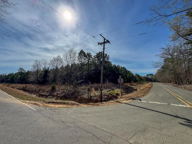 a view of outdoor space with deck and trees