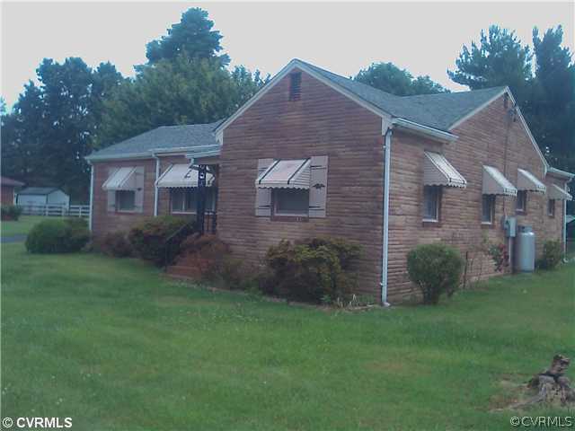 6325 Pole Green Road Mechanicsville, VA 23111 - Photo 1 of 3 a aerial view of a house next to a big yard and large trees
