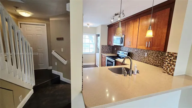 a view of a living room and a balcony