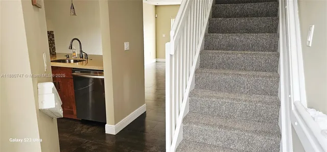 a view of a kitchen from the hallway