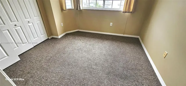 an empty room with a fireplace