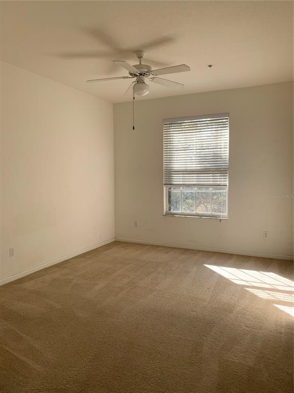 13500 Turtle Marsh Loop, Unit 837 Orlando, FL 32837 - Photo 14 of 30 an empty room with a empty space and windows