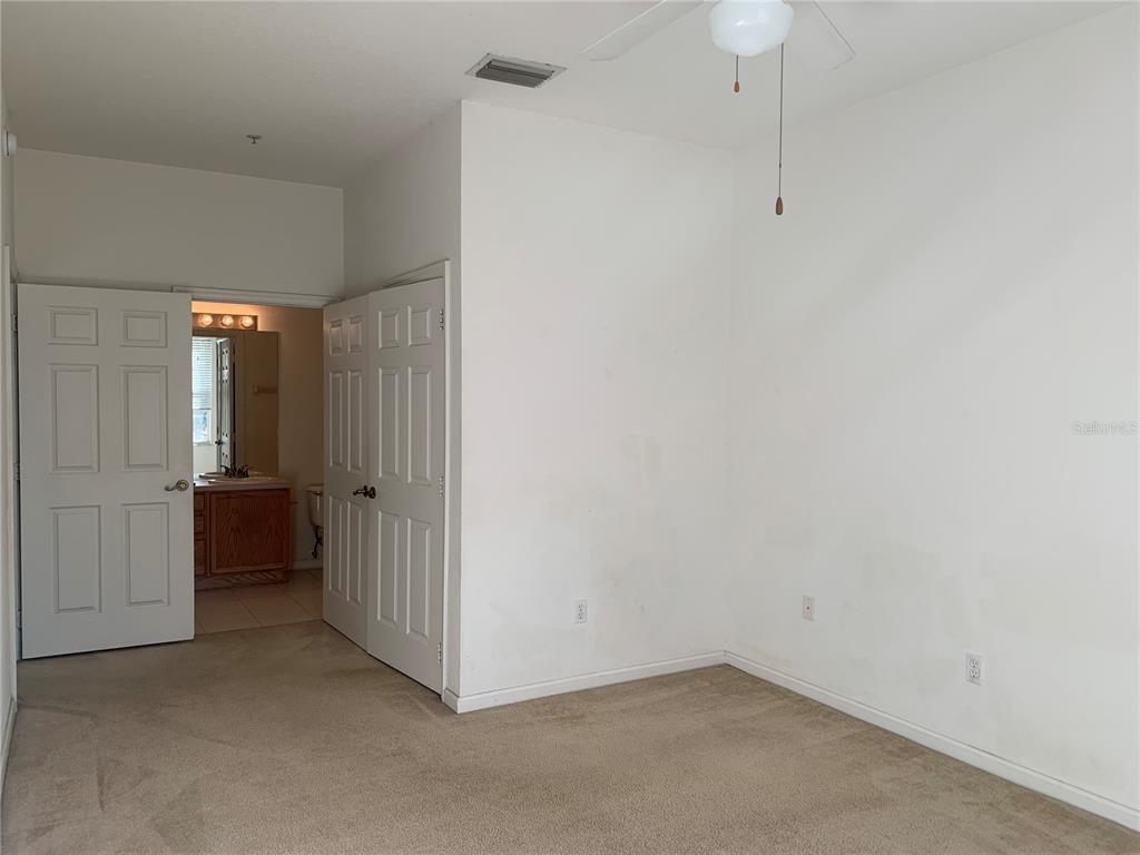 13500 Turtle Marsh Loop, Unit 837 Orlando, FL 32837 - Photo 15 of 30 a view of an empty room with closet and a window