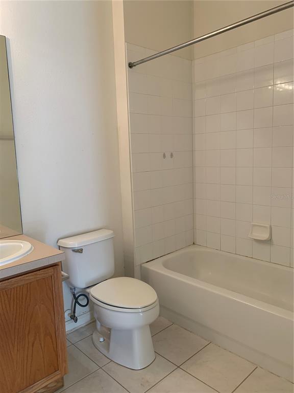 13500 Turtle Marsh Loop, Unit 837 Orlando, FL 32837 - Photo 16 of 30 a white toilet sitting next to a bath tub