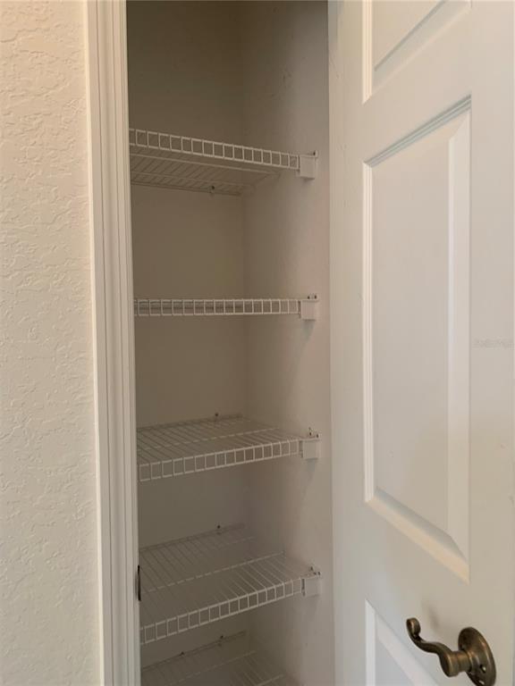 13500 Turtle Marsh Loop, Unit 837 Orlando, FL 32837 - Photo 28 of 30 a bathroom with a glass shower door