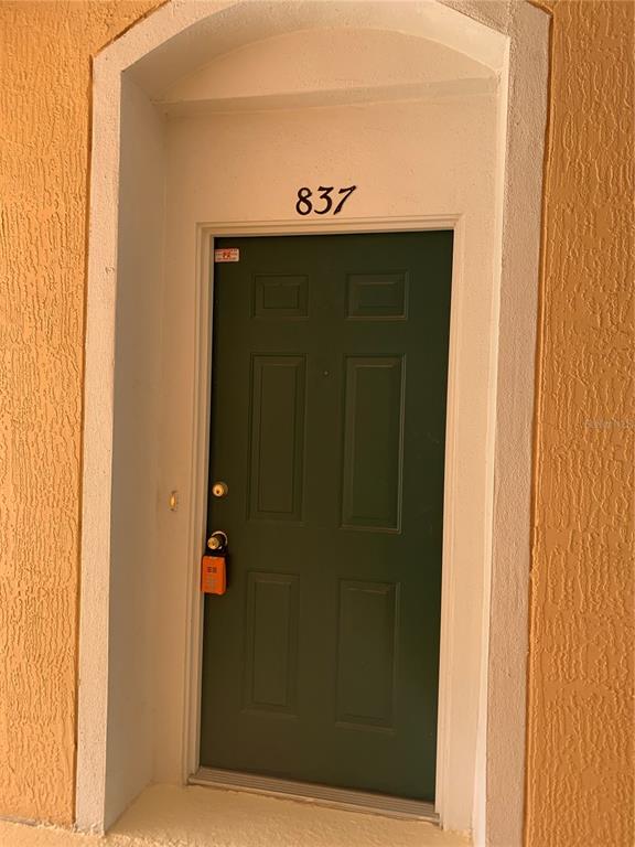 13500 Turtle Marsh Loop, Unit 837 Orlando, FL 32837 - Photo 29 of 30 a view of a hallway with entryway door