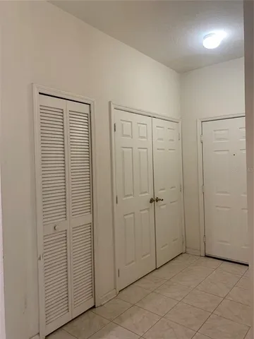 an empty room with closet area