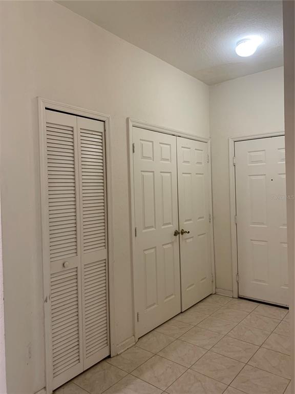 13500 Turtle Marsh Loop, Unit 837 Orlando, FL 32837 - Photo 3 of 30 an empty room with closet area