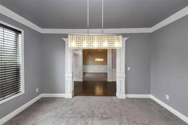 an entryway at an empty room with a window