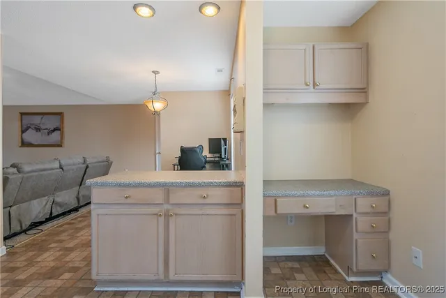 a kitchen with stainless steel appliances granite countertop a refrigerator stove and sink