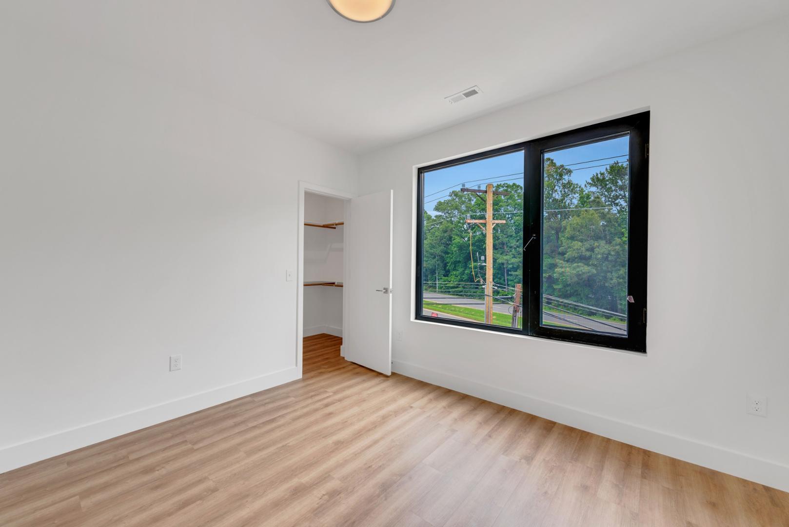 2017 Jade Street Durham, NC 27713 - Photo 25 of 31 a view of a big room with wooden floor and windows