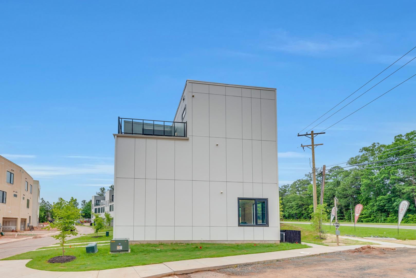 2017 Jade Street Durham, NC 27713 - Photo 28 of 31 a view of a house with a yard and potted plants