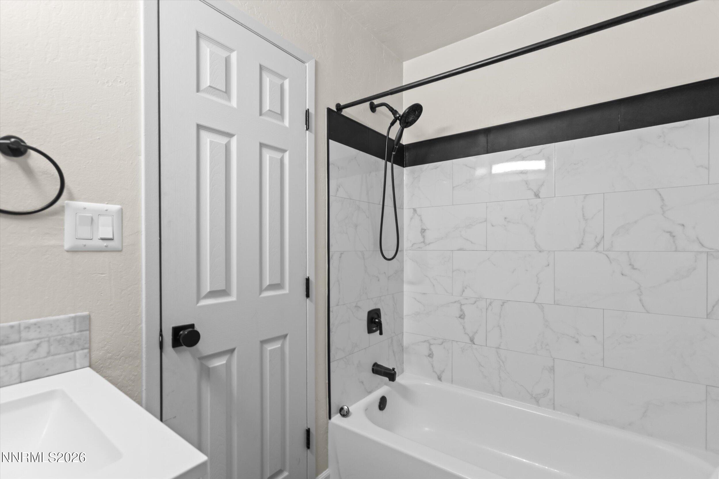 2300 Dickerson Road, Unit 51 Reno, NV 89503 - Photo 22 of 46 a bathroom with a shower a bath tub and a shower