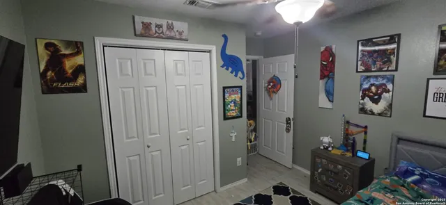 a view of a hallway with workspace and closet