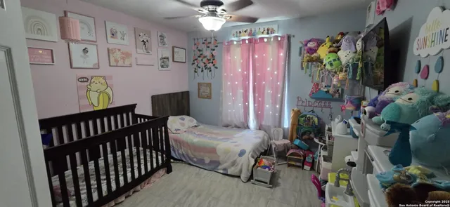 a bedroom with furniture and a bed