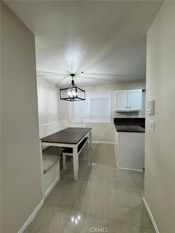 a view of a hallway with seating area