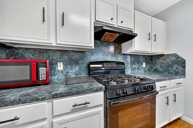 a sink with granite countertop