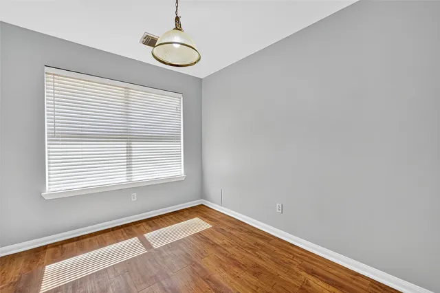 a view of kitchen with wooden floor