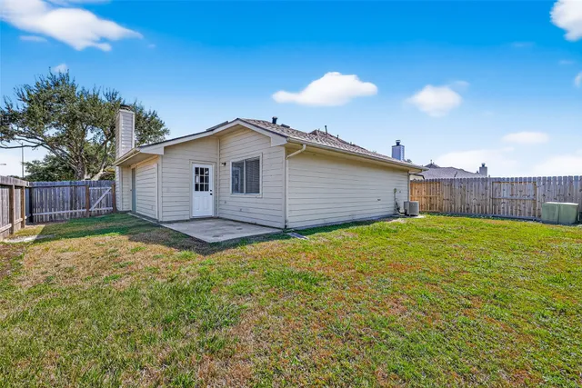 a view of a street with a building in the background
