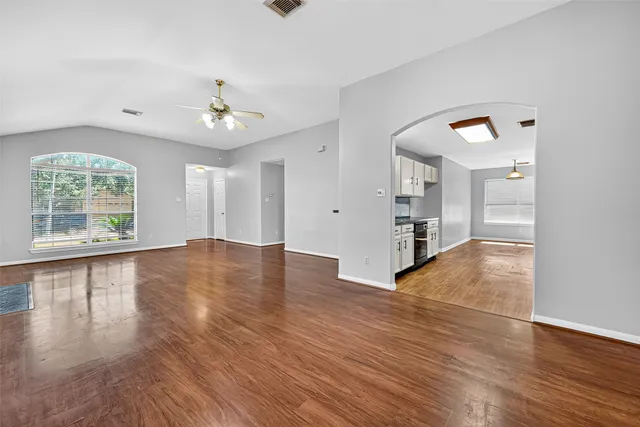 a large kitchen with stainless steel appliances granite countertop a stove and a sink