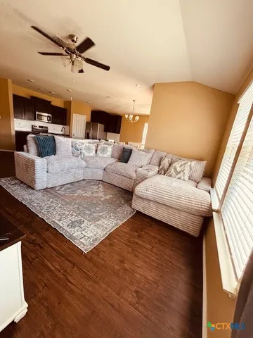 a living room with furniture and a large window