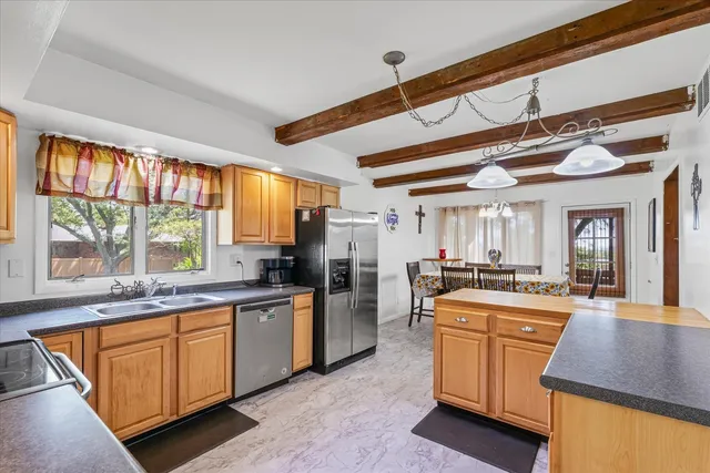 a kitchen with lots of counter top space and appliances
