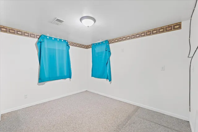 a utility room with cabinets washer and dryer