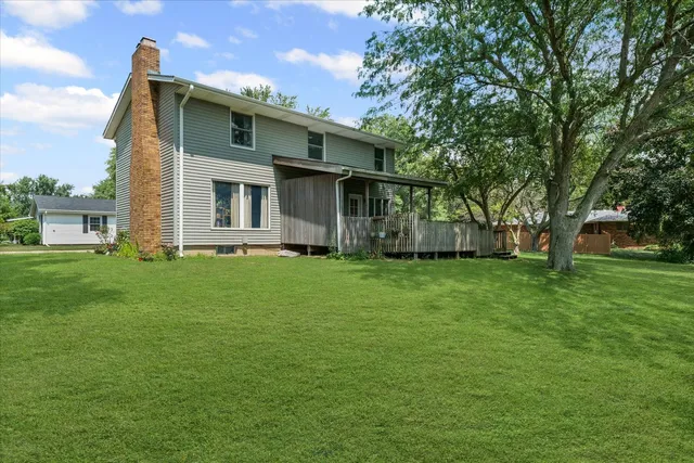 a view of an house with backyard space and garden