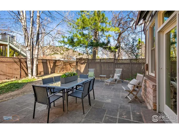 a view of a house with backyard porch and sitting area