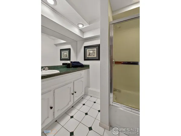 a picture of a bathroom with a shower