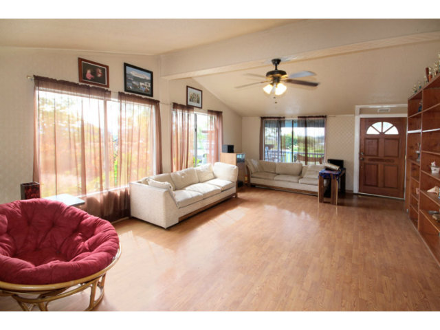 561 Lakeview Road Watsonville, CA 95076 - Photo 2 of 21 a living room with furniture and a large window