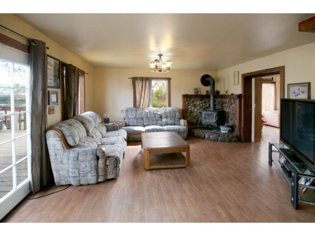 561 Lakeview Road Watsonville, CA 95076 - Photo 5 of 21 a living room with furniture and a flat screen tv
