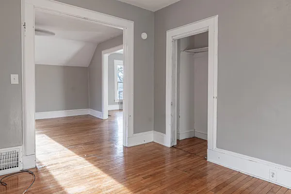 wooden floor & view of bathroom with wooden floor