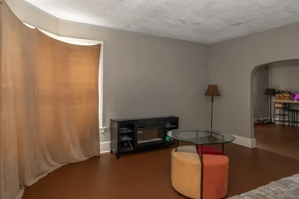 a living room with furniture and a table