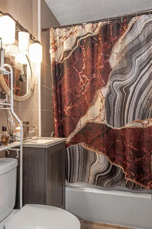 a bathroom with a toilet and a sink