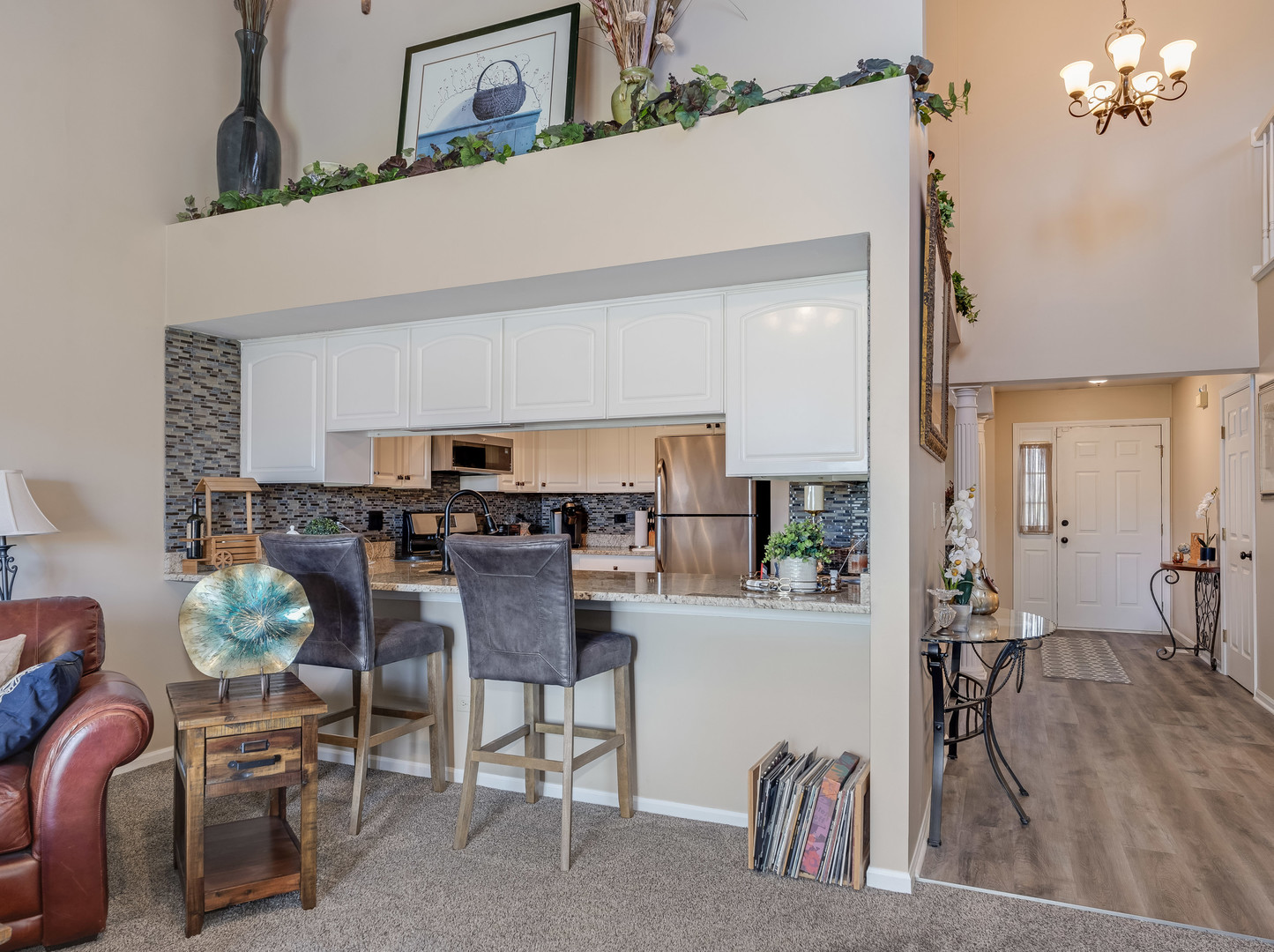3419 Lake Side Circle Joliet, IL 60431 - Photo 13 of 26 a kitchen with a dining table chairs and a refrigerator