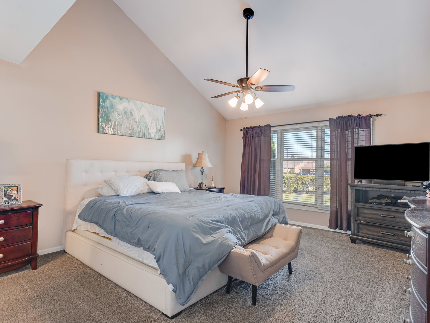 3419 Lake Side Circle Joliet, IL 60431 - Photo 17 of 26 a spacious bedroom with a bed and a flat screen tv