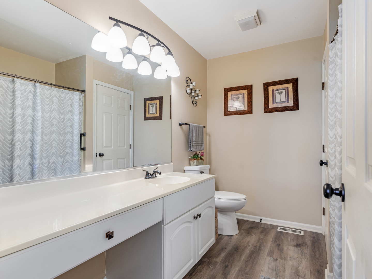 3419 Lake Side Circle Joliet, IL 60431 - Photo 19 of 26 a spacious bathroom with a double vanity sink mirror and toilet