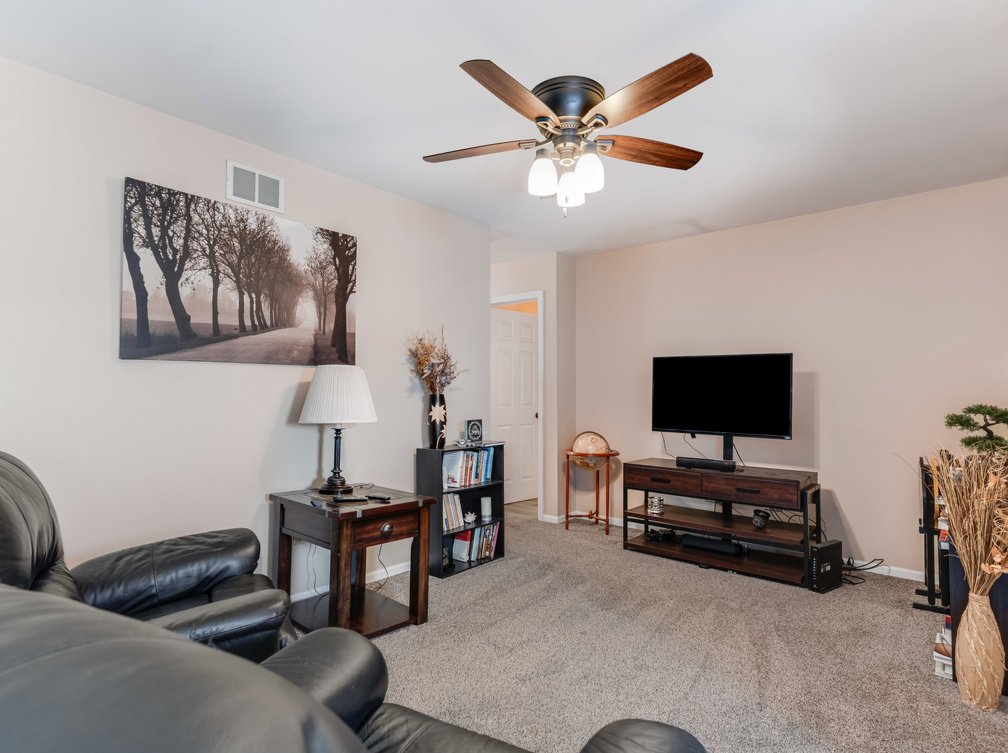 3419 Lake Side Circle Joliet, IL 60431 - Photo 21 of 26 a living room with furniture and a flat screen tv