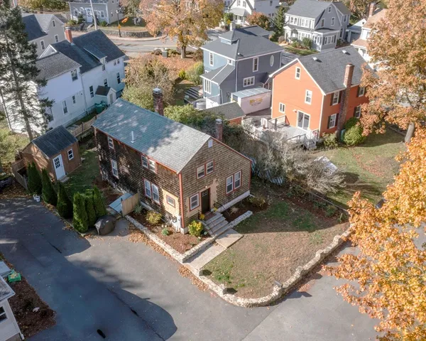 an aerial view of houses with yard