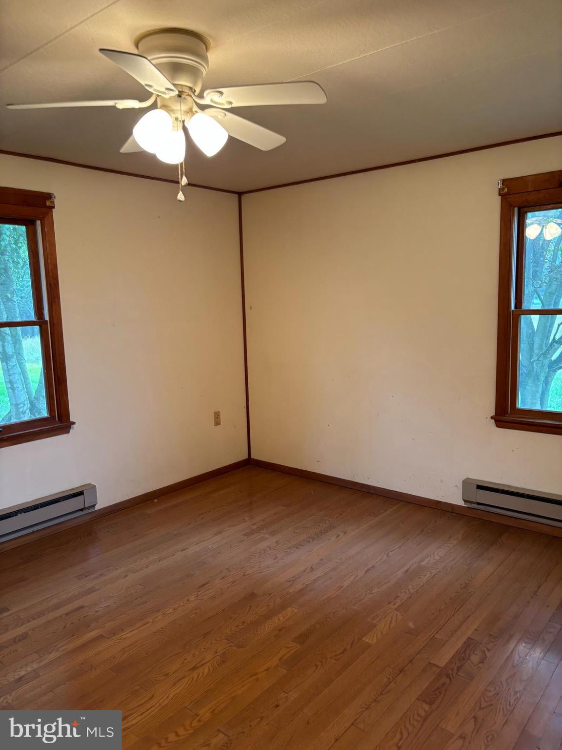 1072 Calvert Road Rising Sun, MD 21911 - Photo 16 of 17 a view of a room with wooden floor and a window