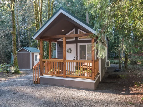 a view of backyard with a deck and a garden