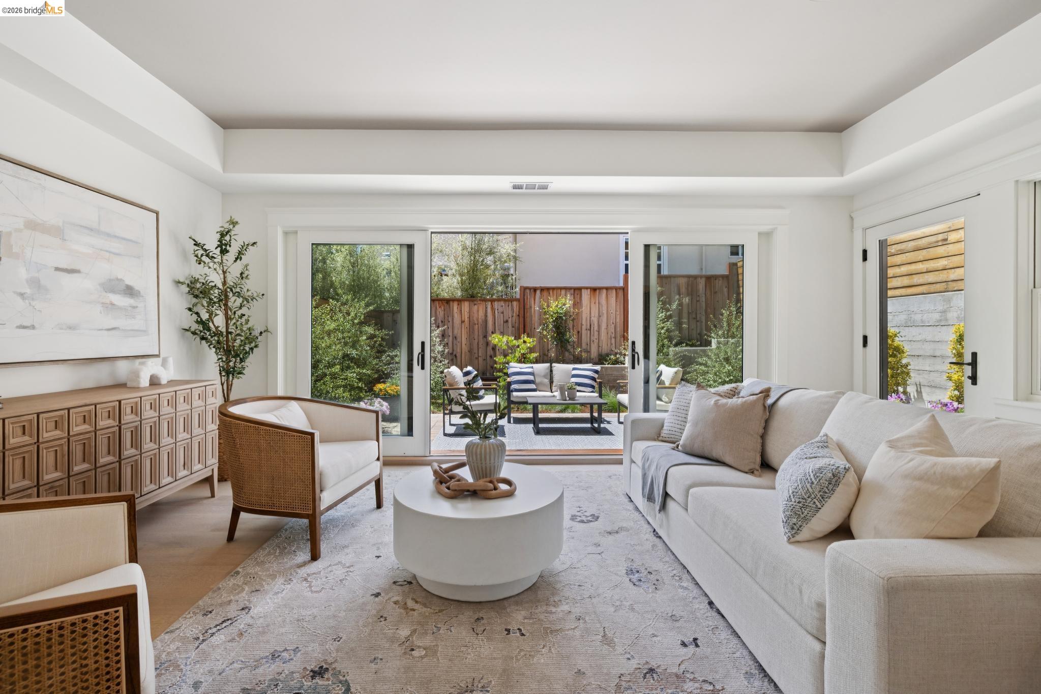 4430 Howe Street Oakland, CA 94611 - Photo 12 of 58 a living room with furniture and a potted plant